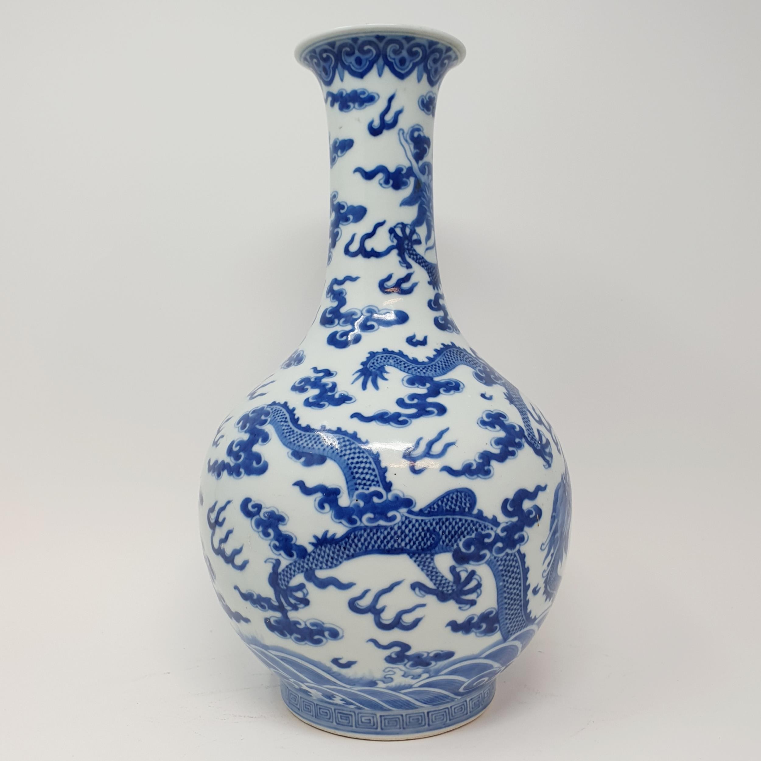 A Chinese underglazed blue and white vase, decorated dragons, 35 cm high Some firing faults, a - Image 5 of 10