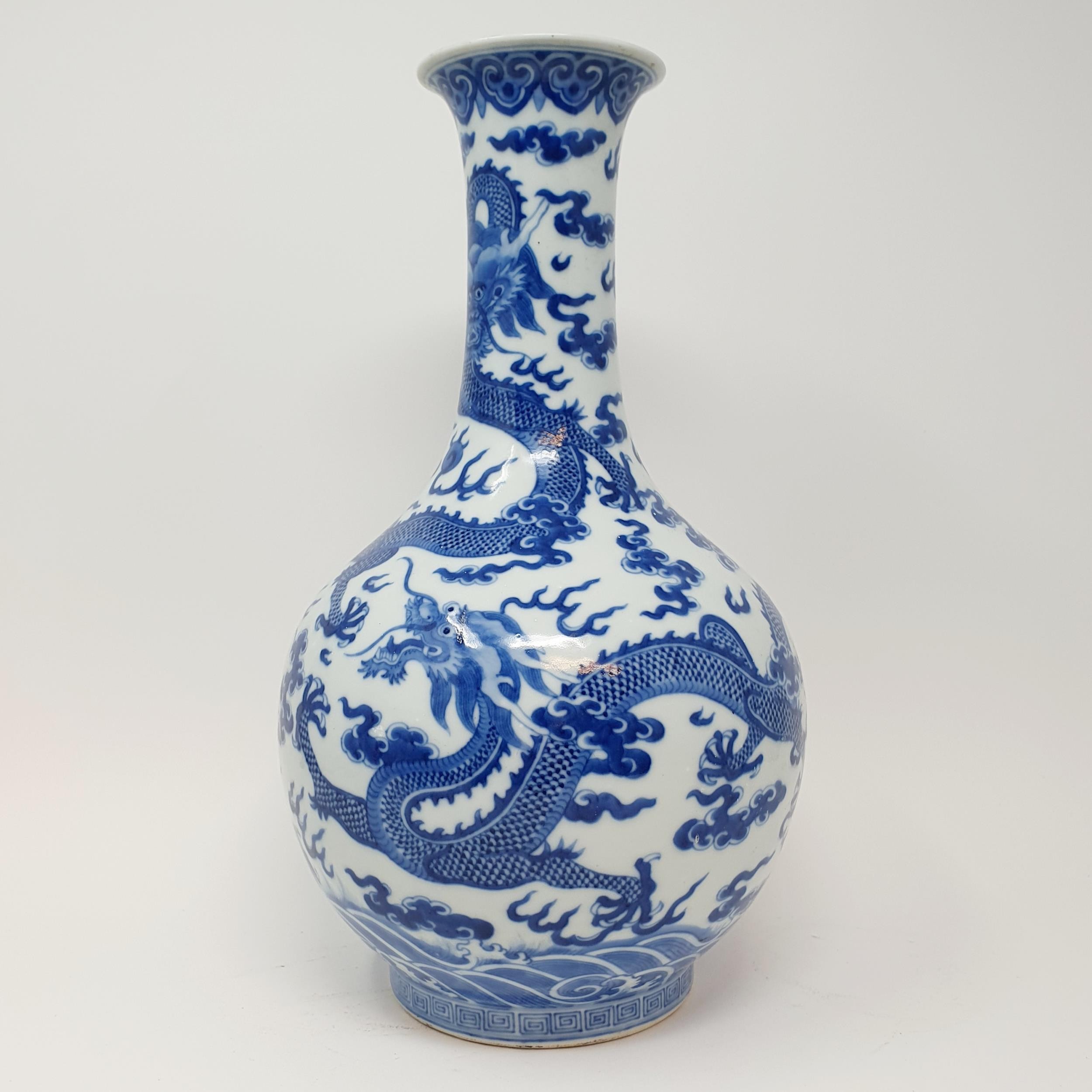 A Chinese underglazed blue and white vase, decorated dragons, 35 cm high Some firing faults, a - Image 3 of 10