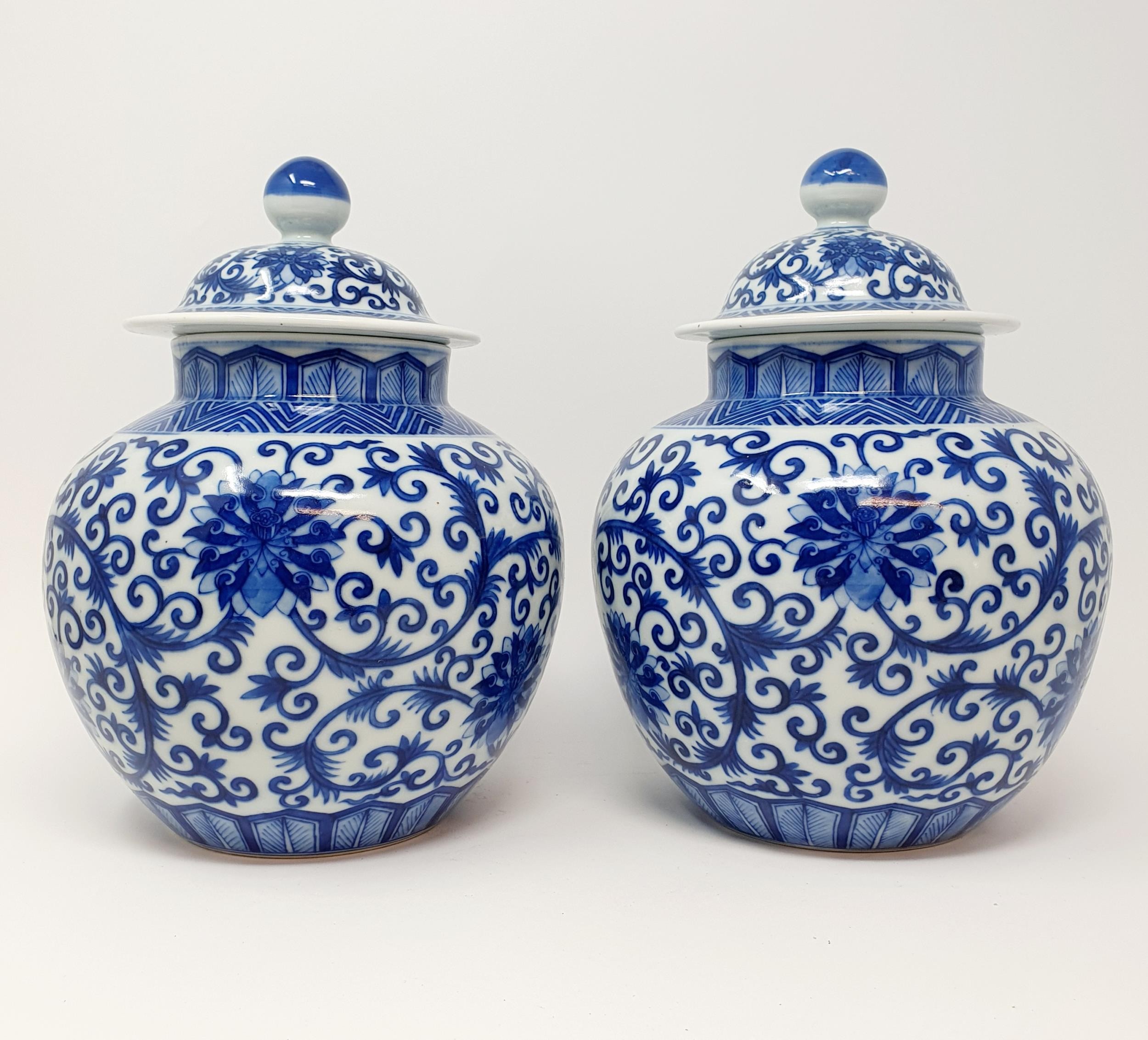 A pair of Chinese underglazed blue and white vases and covers, decorated foliate forms, six