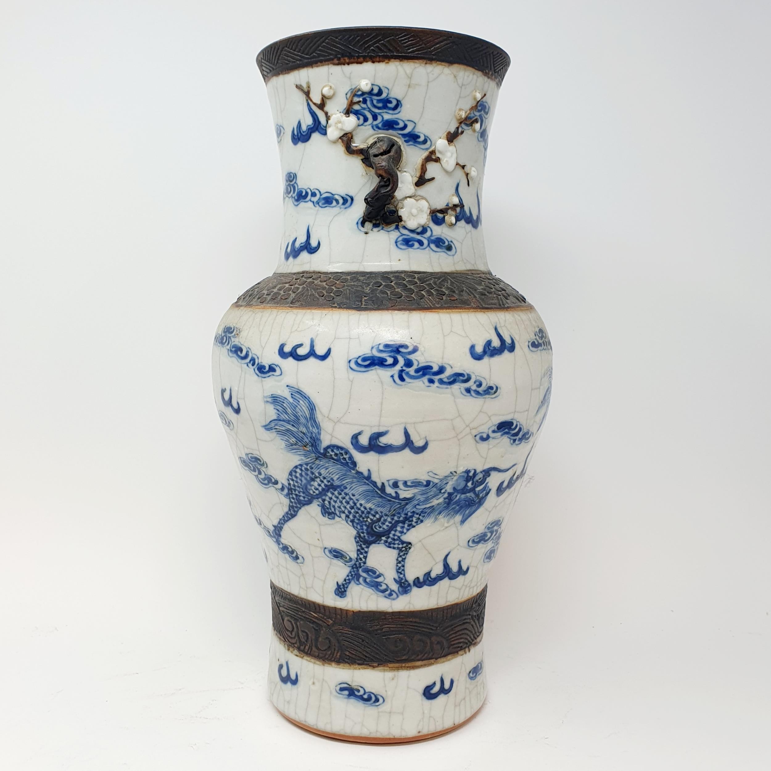 A Chinese underglazed blue and white vase, with a crackled glaze, decorated mythical beasts, 38 cm - Image 5 of 10