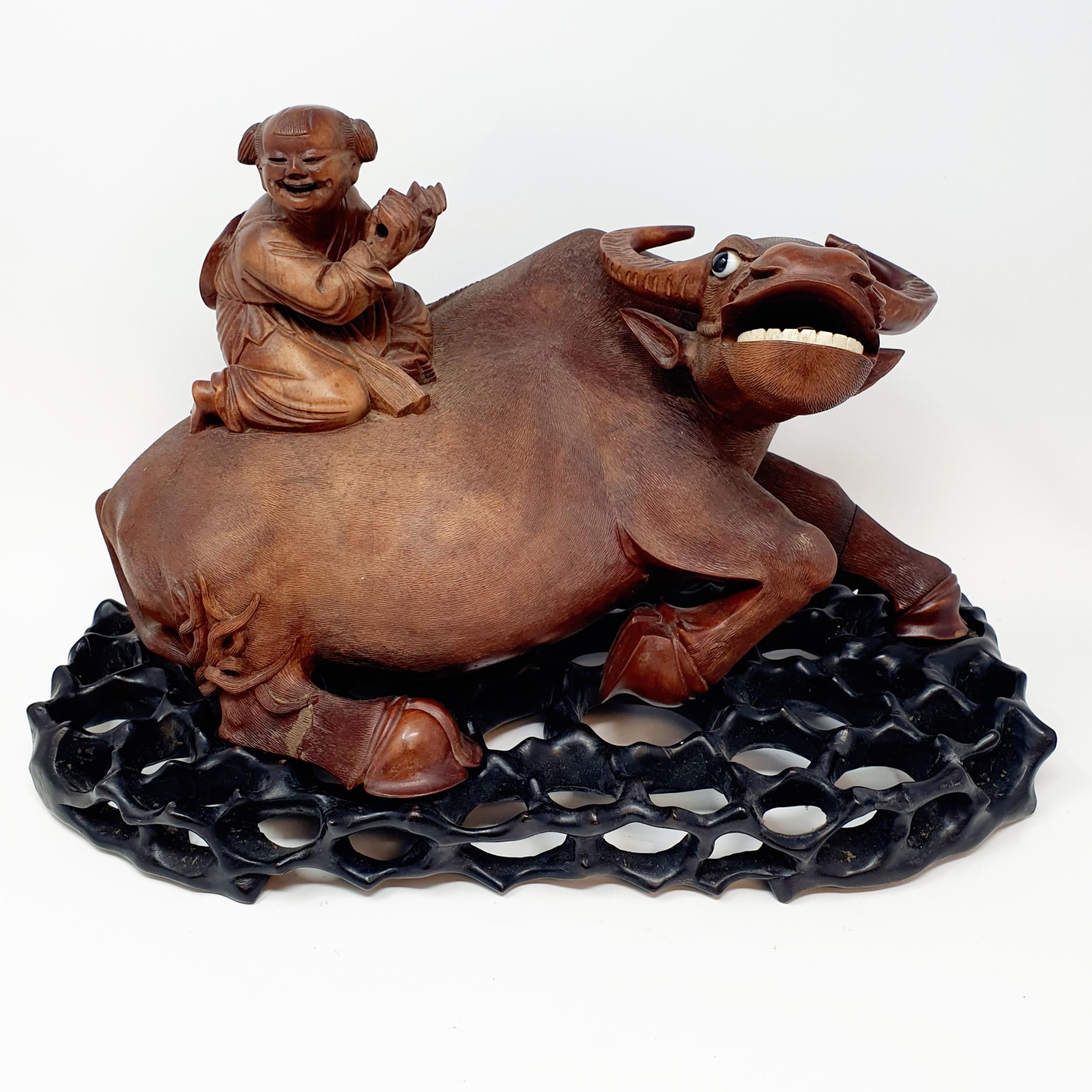 A Chinese carving of a water buffalo, with a seated figure, on a hardwood stand, 40 cm high - Image 2 of 7