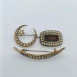 A 15ct gold and seed pearl crescent brooch, and two other brooches (3)