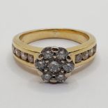 An 18ct gold and diamond cluster ring, ring size K 1/2