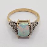 An 18ct gold, opal and diamond ring, ring size M