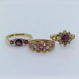 An early 20th century, pearl and garnet ring, ring size J, and two other rings