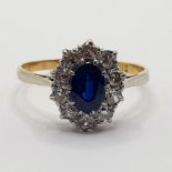 An 18ct gold, sapphire and diamond cluster ring, ring size Q