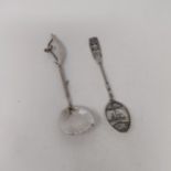 A Dutch commemorative silver spoon, and a 20th century white metal spoon, with a shell bowl (2)