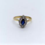An 18ct gold, diamond and sapphire cluster ring, ring size L