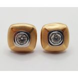 A pair of Boodles Amare 18ct gold, platinum and diamond set ear studs Provenance: From a large