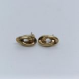 A pair of yellow metal stud earrings Provenance: From a large single owner collection of jewellery