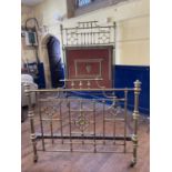 A late Victorian/Edwardian brass half tester bed, 4ft 6 inches wide One piece from the finial off