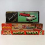 A Chinese friction powered Standard Saloon convertible toy car, a Magic Robot game and a driving