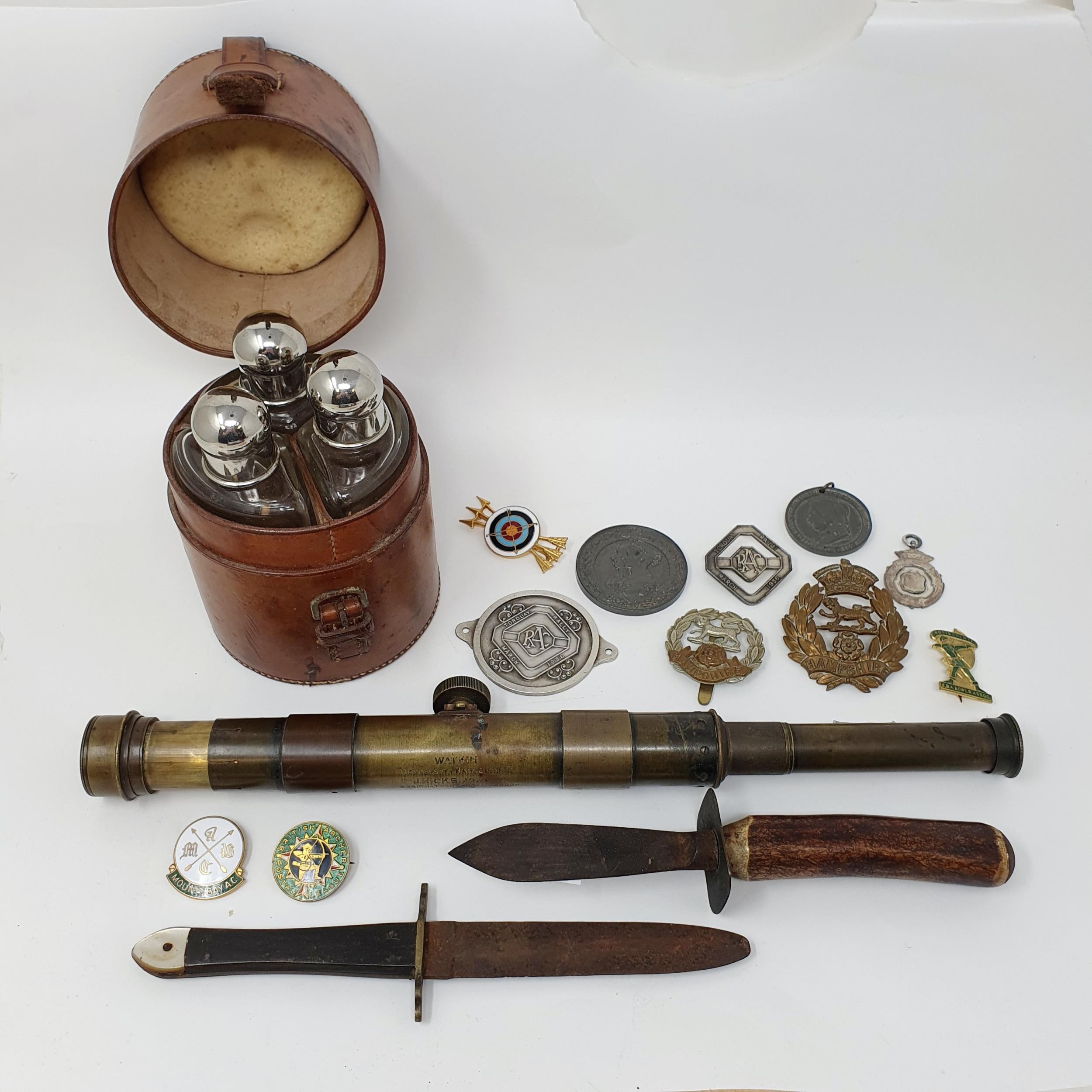 Two small daggers, a Watkin's Depression Range Finder, a group of Chinese cash coins and other items