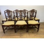 A set of seven George III style mahogany shield back dining chairs (6+1)