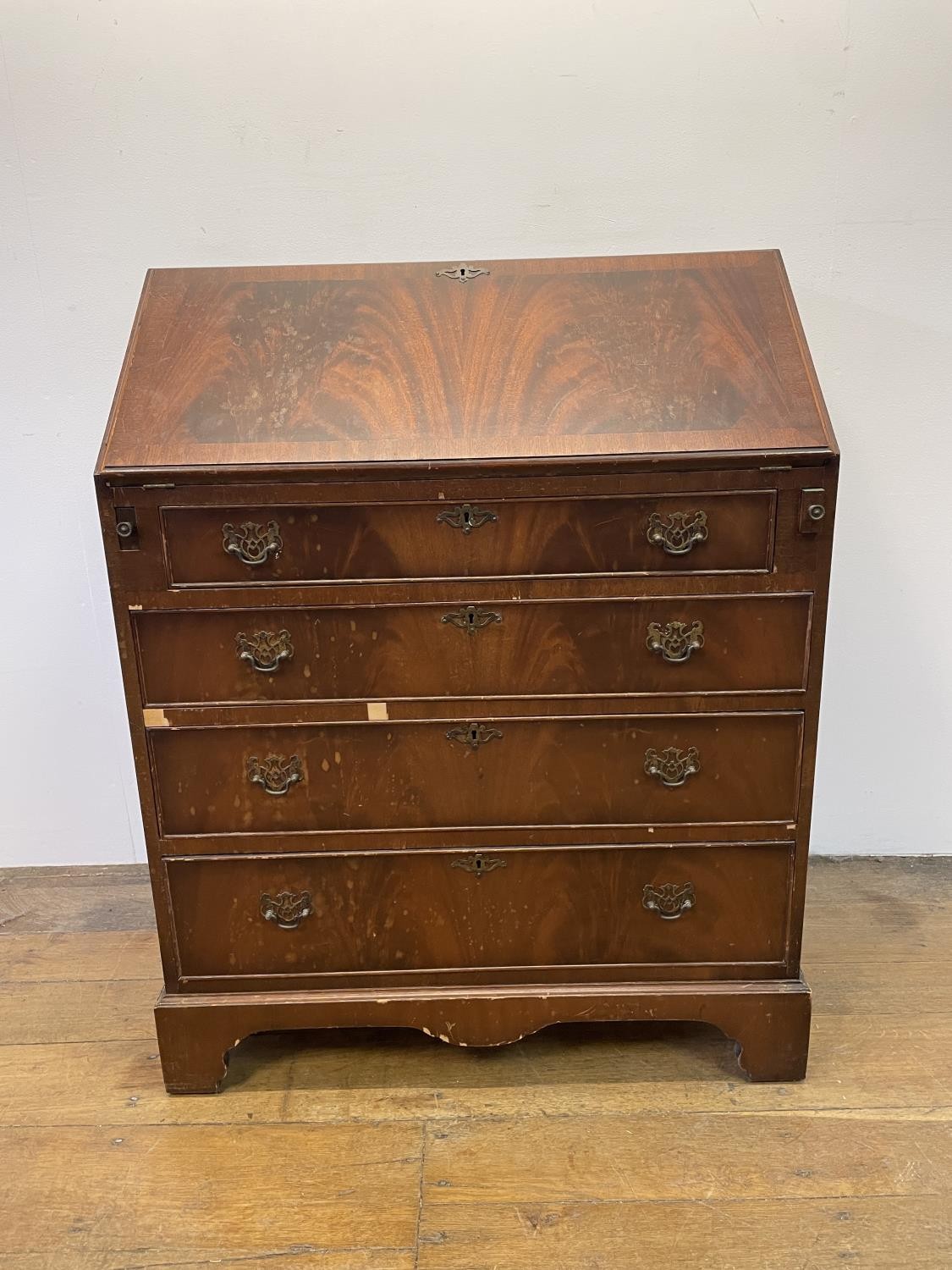 A George III style mahogany bureau, 77 cm wide various losses