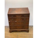 A George III style mahogany bureau, 77 cm wide various losses