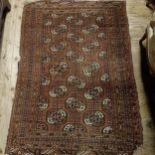 A Turkomon rug, 175 x 123 cm Some losses and general wear, variation of colour