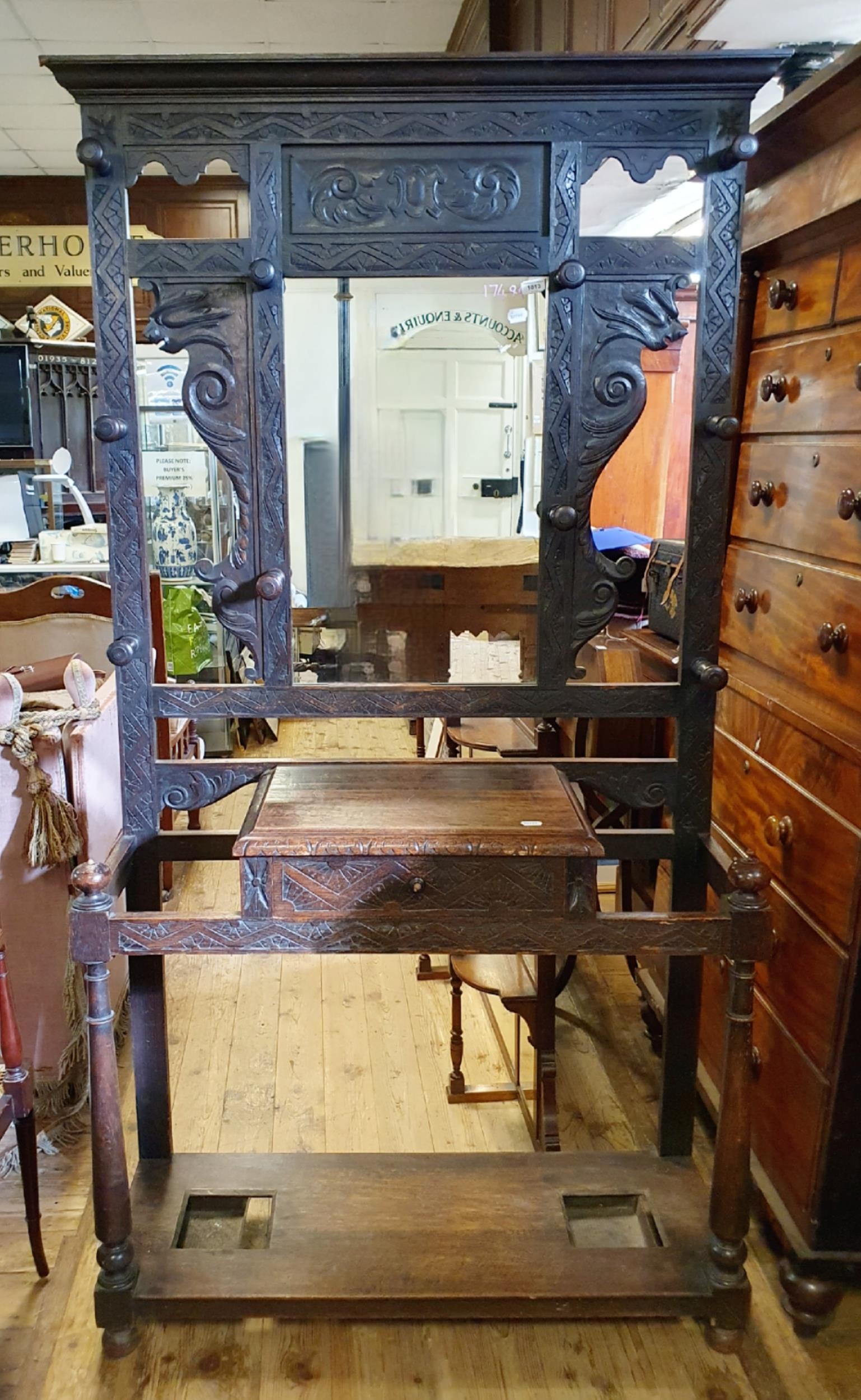 A late Victorian carved oak hall stand, 115 cm wide