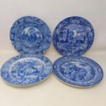 A blue and white plate, decorated a landscape, 25 cm diameter, and three others (4)