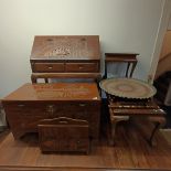 A carved camphorwood trunk, 92 cm wide, a similar bureau, a magazine rack, two coffee tables, and