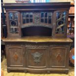 A Continental dresser, the superstructure with four glazed cupboards, on a base with three