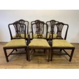 A set of seven George III style mahogany dining chairs, with pierced splat backs, drop in seats