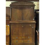 A Continental mahogany escritoire, the top with two cupboard doors, above a full front and