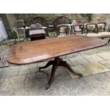 A mahogany tilt top breakfast table, crossbanded in rosewood, the top 67 x 102 cm