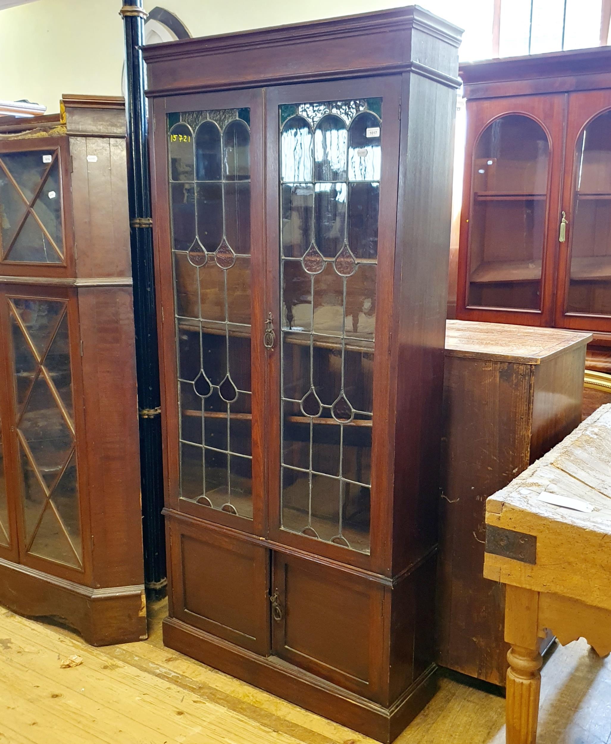 An early 20th century oak bookcase, with leaded glazed panels, 180 cm high x 92 cm wide