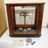 A set of laboratory scales, in a mahogany case, 45 cm wide