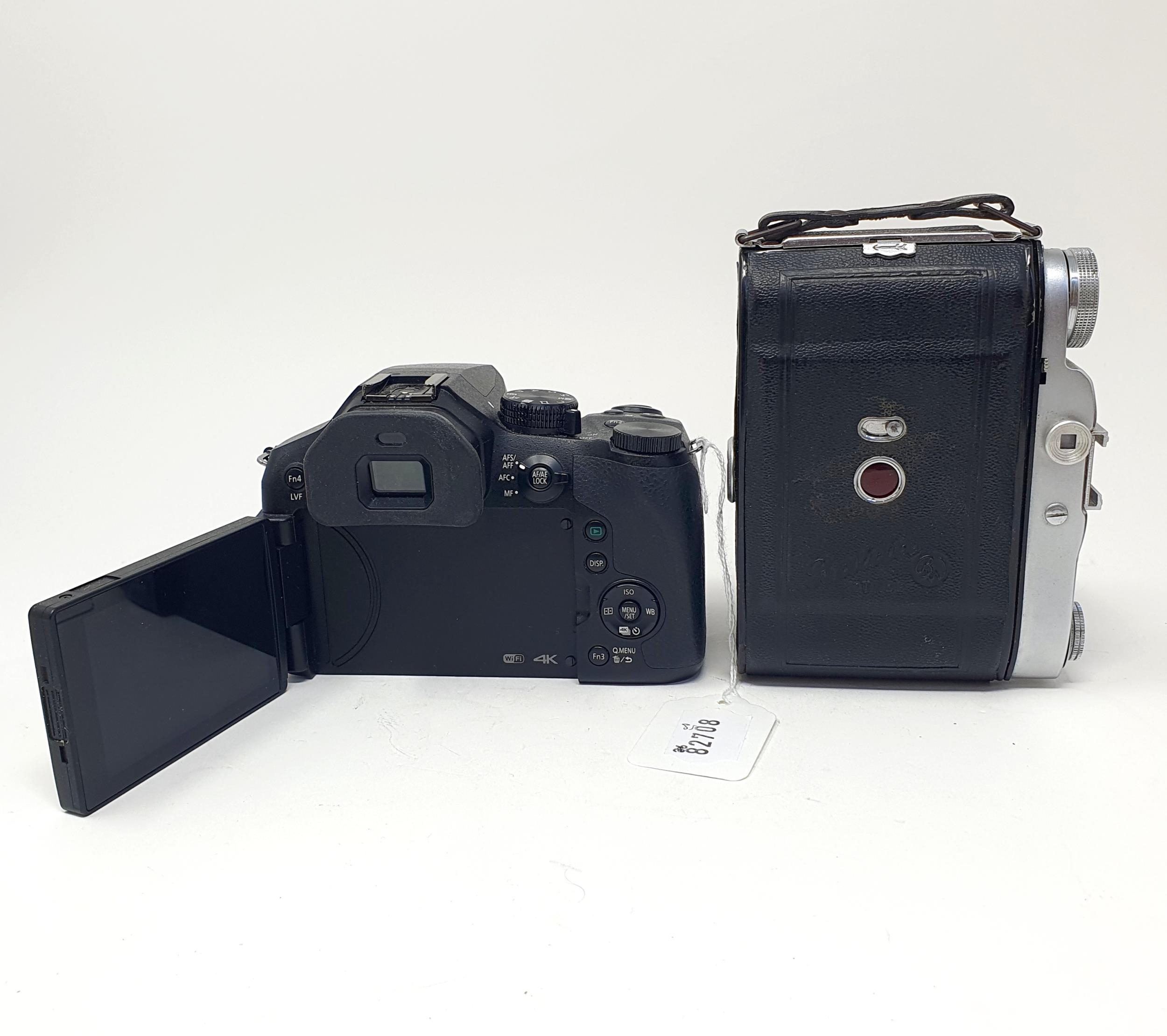 A Balda camera, in a leather case, and a Panasonic Lumix digital camera No. 25-600 (2) Provenance: - Image 2 of 5