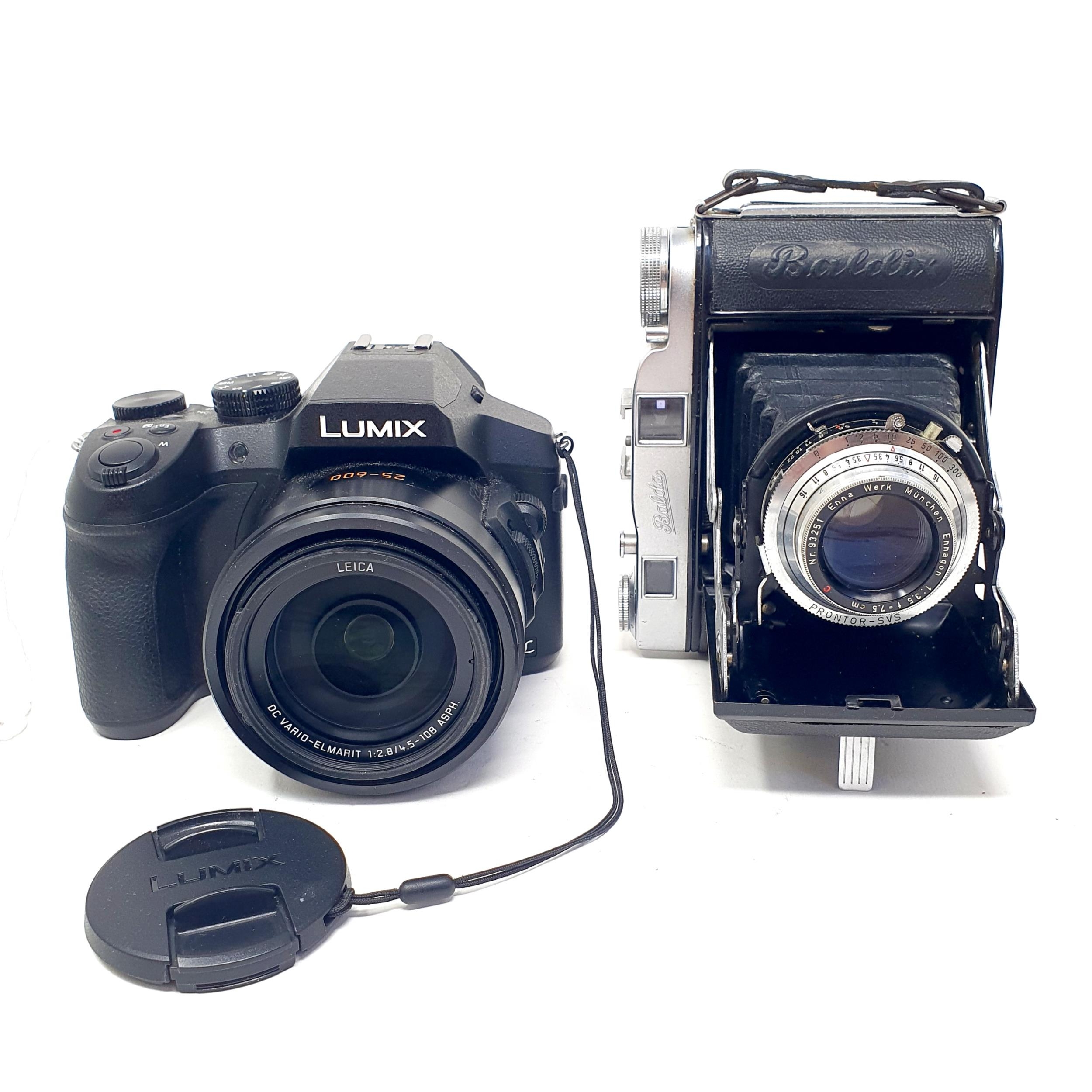 A Balda camera, in a leather case, and a Panasonic Lumix digital camera No. 25-600 (2) Provenance: