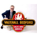 A Vauxhall Bedford Sales and Service target style double sided enamel sign, in a metal frame with