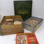 An early 20th century scrapbook, and three jigsaws (4) Provenance: Sold on behalf of SNCB Society
