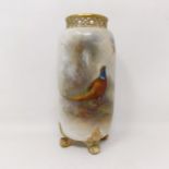 A Royal Worcester vase, with a pierced rim, decorated a pheasant, 15 cm high No chips or cracks or