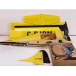 A remote control model aeroplane and assorted parts, partially constructed (qty)