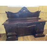 A late 19th century mahogany sideboard, with a carved pierced raised back, above a base with a