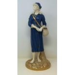 A Royal Worcester figure of a lady holding a basket, 44 cm high