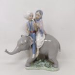 A Lladro group of two children riding an elephant, 24 cm high No chips, cracks or restoration found