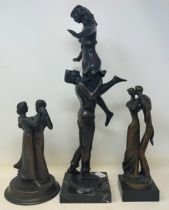 A 20th century bronze group of two dancers, on a polished slate base, 43 cm high, and two others (3)