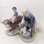 A pair of Royal Copenhagen groups, the cowgirl and cowboy, 16 cm high The cowboy has a chip to his