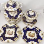 A 19th century service, with a blue border, centre decorated landscapes, comprising two tureens