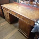 A late 19th/early 20th century mahogany pedestal desk, the top with three drawers, on pedestals with
