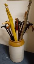 Assorted walking sticks, in a large earthenware pot (qty)