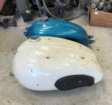 A Triumph petrol tank, and another (2) Being sold without reserve