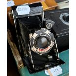 A Kodak bellows camera, a Kodak mahogany film tank box, assorted other cameras (qty) Provenance: