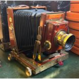 A Thornton Pickard bellows camera and plates, in a mahogany case (4) Provenance: From a vast