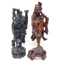 A Chinese carving of an old man, 40 cm high, and another, 44 cm high (2)