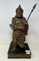 A Japanese carving of a warrior, 42 cm high Aged