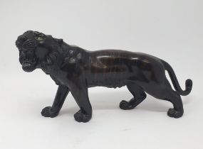 A Japanese bronze tiger, signed, 38 cm wide In our opinion this is a 20th century copy
